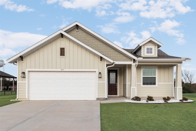 view of front of home with a garage and a front yard