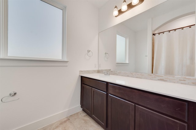 bathroom featuring vanity and tile patterned flooring