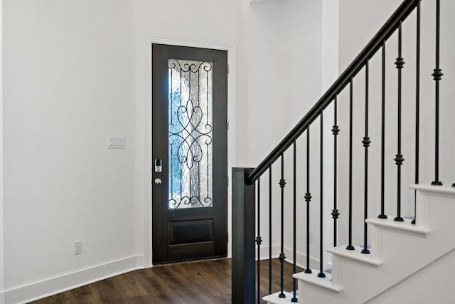 foyer entrance featuring dark hardwood / wood-style floors