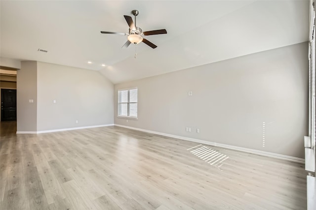 unfurnished room with ceiling fan, light hardwood / wood-style flooring, and vaulted ceiling