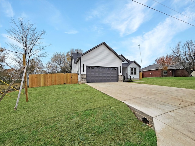 ranch-style home featuring a front yard and a garage