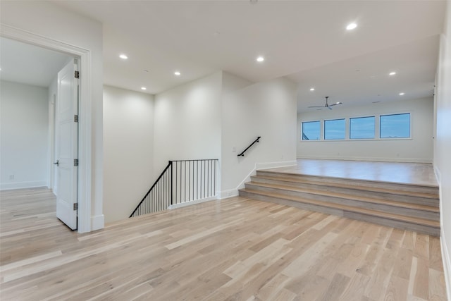 unfurnished room with ceiling fan and light hardwood / wood-style floors