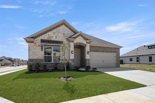 french country style house featuring driveway, stone siding, an attached garage, a front yard, and brick siding