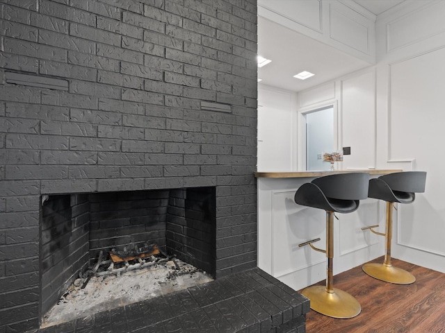 room details featuring hardwood / wood-style floors and a fireplace