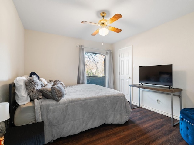 bedroom with ceiling fan and dark hardwood / wood-style floors