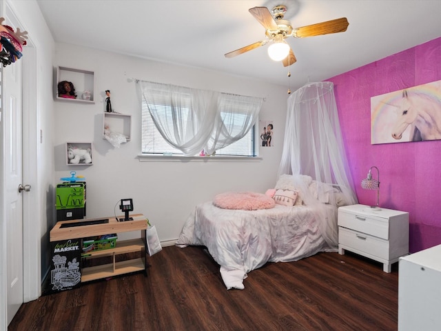 bedroom with ceiling fan and dark hardwood / wood-style flooring