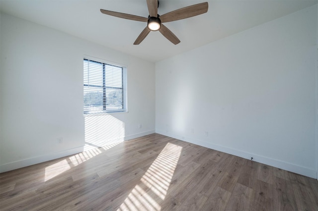 spare room with ceiling fan and light hardwood / wood-style flooring