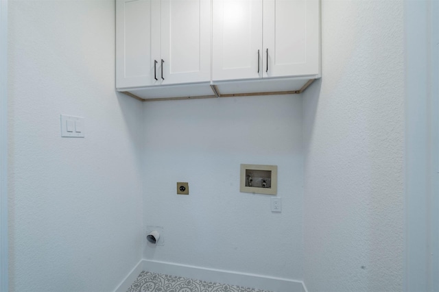 laundry room with electric dryer hookup, cabinets, and hookup for a washing machine