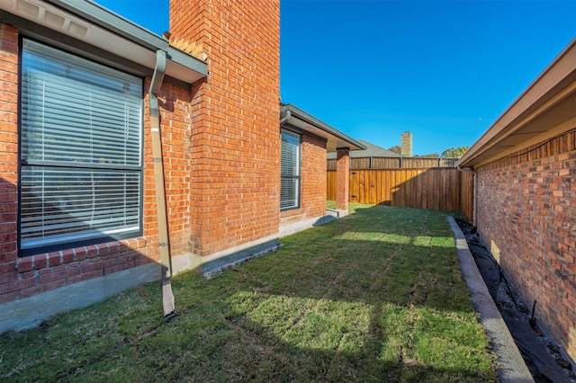 view of home's exterior with a lawn