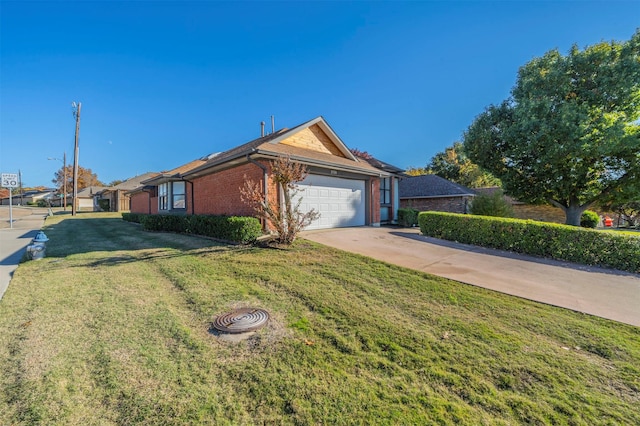 ranch-style house featuring a garage and a front lawn