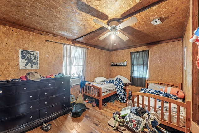 bedroom featuring ceiling fan and hardwood / wood-style floors