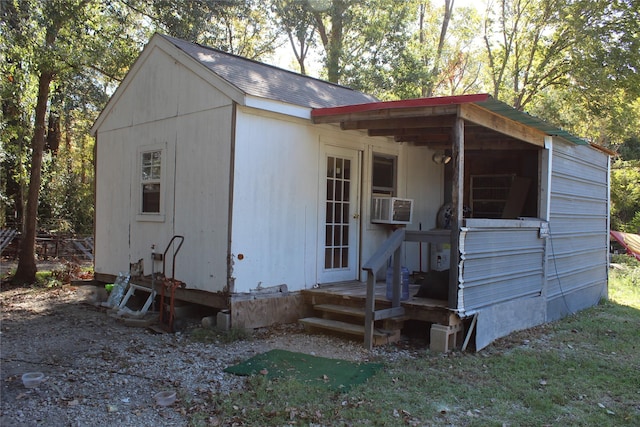 view of outbuilding featuring cooling unit