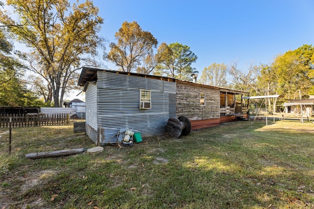 exterior space with a yard and cooling unit