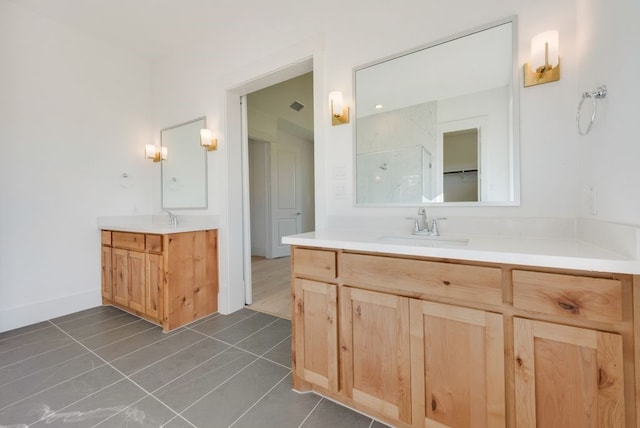 bathroom with tile patterned floors and vanity