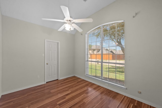 unfurnished room featuring ceiling fan, lofted ceiling, and dark hardwood / wood-style flooring