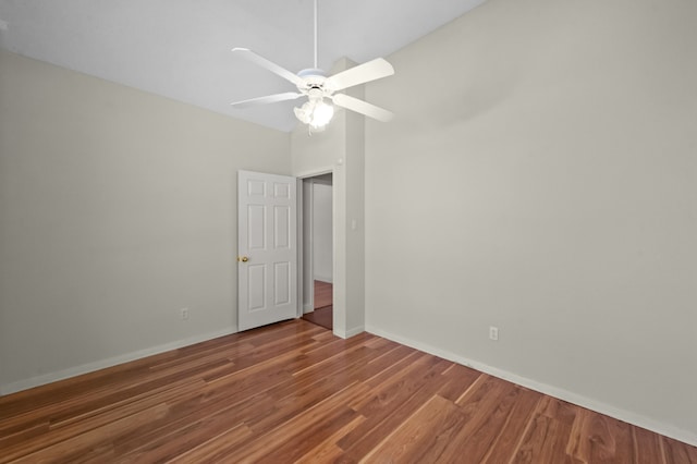 spare room featuring hardwood / wood-style flooring and ceiling fan