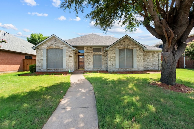 single story home featuring a front yard