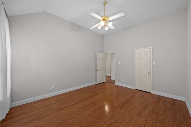 unfurnished bedroom featuring hardwood / wood-style flooring, ceiling fan, and lofted ceiling