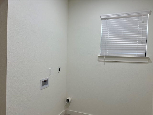 clothes washing area featuring hookup for an electric dryer and hookup for a washing machine