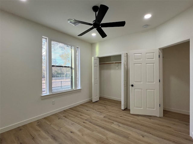 unfurnished bedroom featuring light wood-type flooring, a closet, and ceiling fan