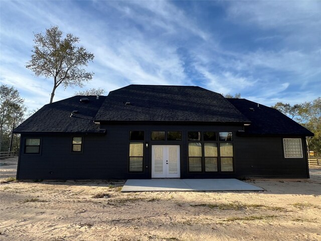 rear view of property with a patio area and french doors