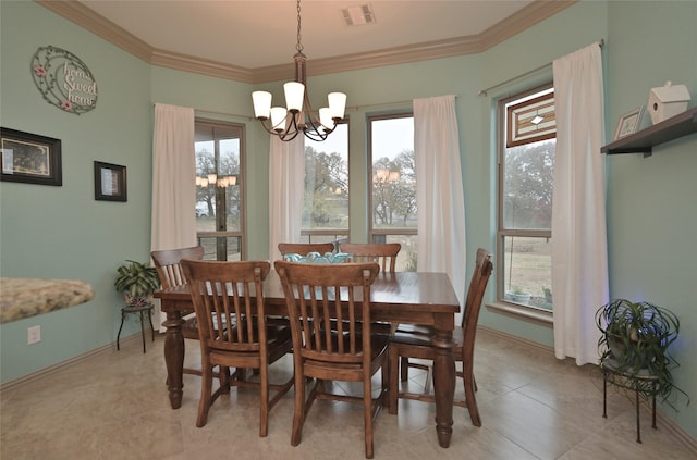 dining room with an inviting chandelier, ornamental molding, and light tile patterned flooring