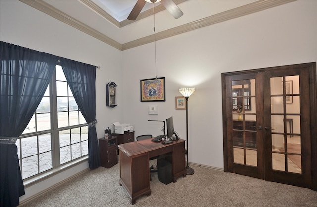 carpeted home office featuring ceiling fan, french doors, and crown molding