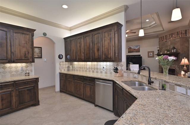 kitchen featuring pendant lighting, dishwasher, sink, ornamental molding, and dark brown cabinetry