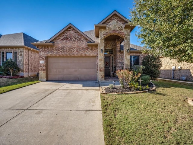 3308 Estacado Dr, Denton, TX 76210 - view of front of home with an attached garage, concrete driveway, a shingled roof, a front lawn, and brick siding