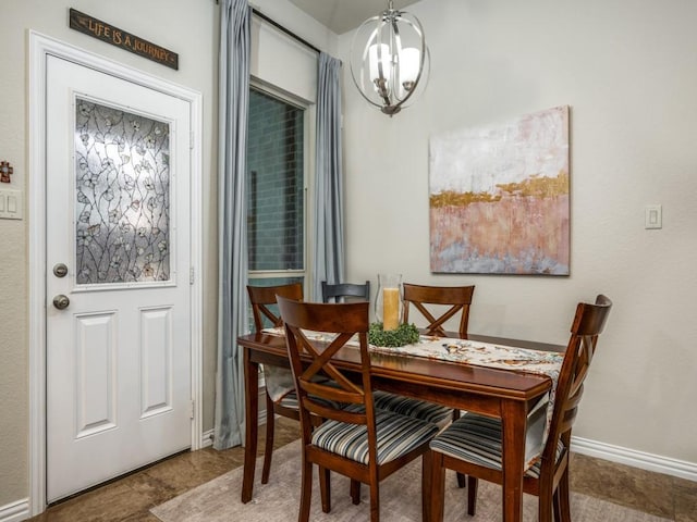 dining space featuring a notable chandelier