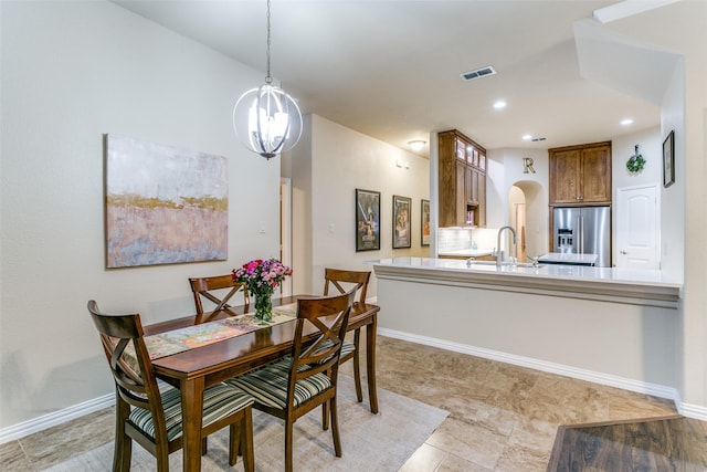 3308 Estacado Dr, Denton, TX 76210 - dining area with baseboards, arched walkways, visible vents, and recessed lighting