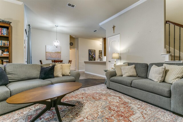 3308 Estacado Dr, Denton, TX 76210 - living area featuring stairs, ornamental molding, visible vents, and wood finished floors
