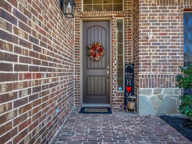 3308 Estacado Dr, Denton, TX 76210 - view of exterior entry featuring brick siding