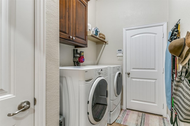 3308 Estacado Dr, Denton, TX 76210 - washroom featuring cabinet space, light wood-type flooring, and washer and dryer