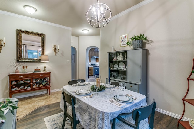 3308 Estacado Dr, Denton, TX 76210 - dining area featuring a notable chandelier, baseboards, crown molding, arched walkways, and dark wood-style floors