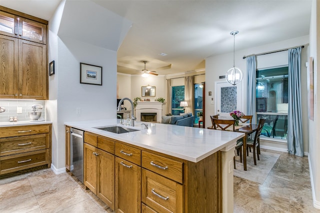 3308 Estacado Dr, Denton, TX 76210 - kitchen with a peninsula, light countertops, a sink, brown cabinetry, and dishwasher