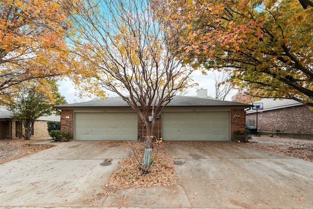 single story home with a garage