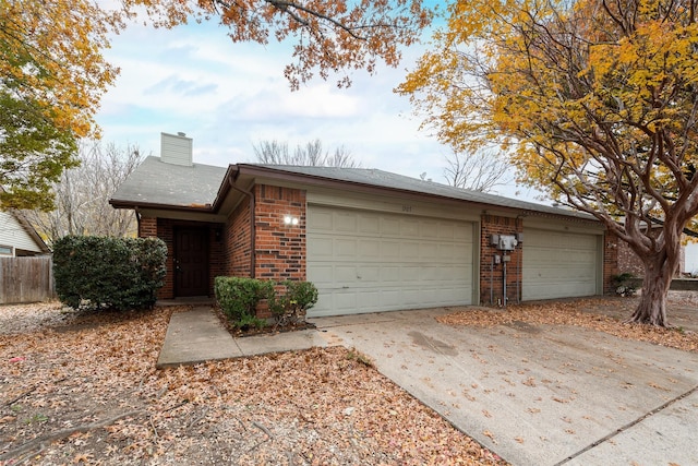 ranch-style house featuring a garage