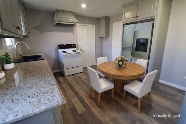 kitchen featuring backsplash, baseboards, custom range hood, electric range, and a sink