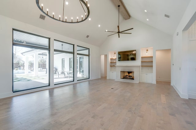 unfurnished living room featuring beamed ceiling, high vaulted ceiling, ceiling fan with notable chandelier, and light hardwood / wood-style floors