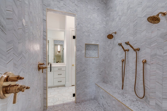 bathroom featuring tile walls, tile patterned floors, and tiled shower