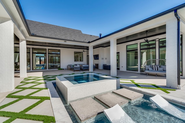 view of pool featuring an in ground hot tub, ceiling fan, an outdoor hangout area, and a patio