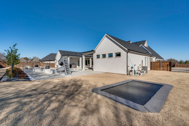 back of property with a patio