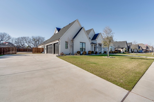 view of front of home featuring a garage and a front lawn