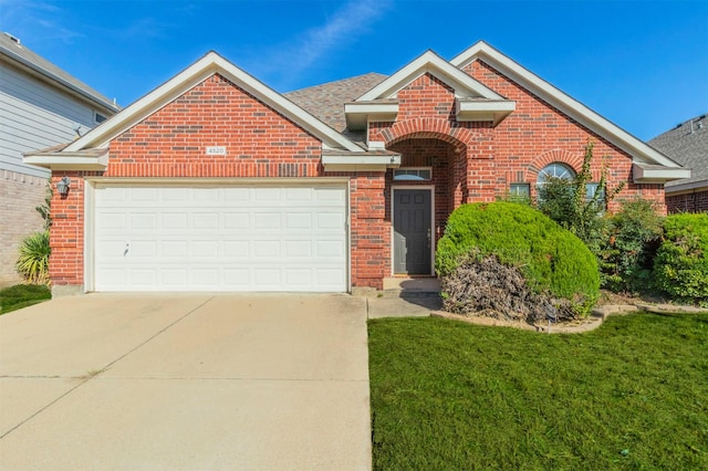 front facade with a front lawn and a garage