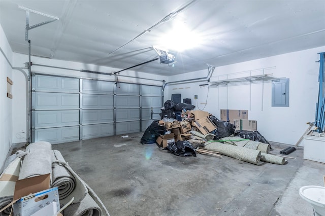 garage with a garage door opener and electric panel