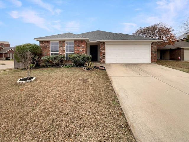 ranch-style house with a garage and a front yard