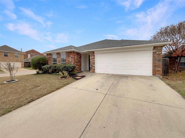 single story home with a garage and a front lawn