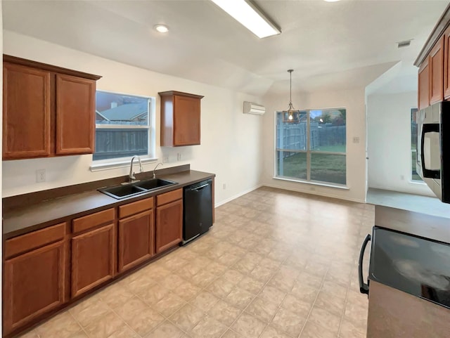 kitchen featuring pendant lighting, black dishwasher, sink, and a wall unit AC