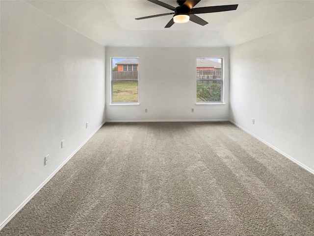 empty room featuring ceiling fan and carpet floors